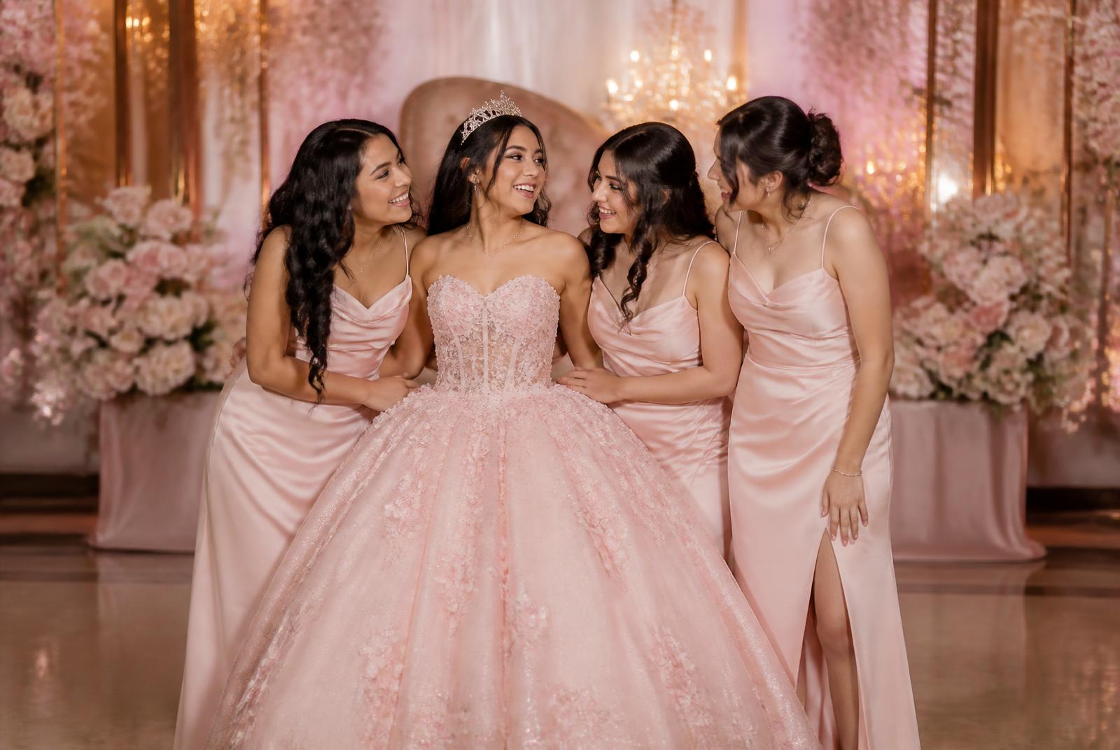 A Quinceañera and her mother posing for a 4×6 print