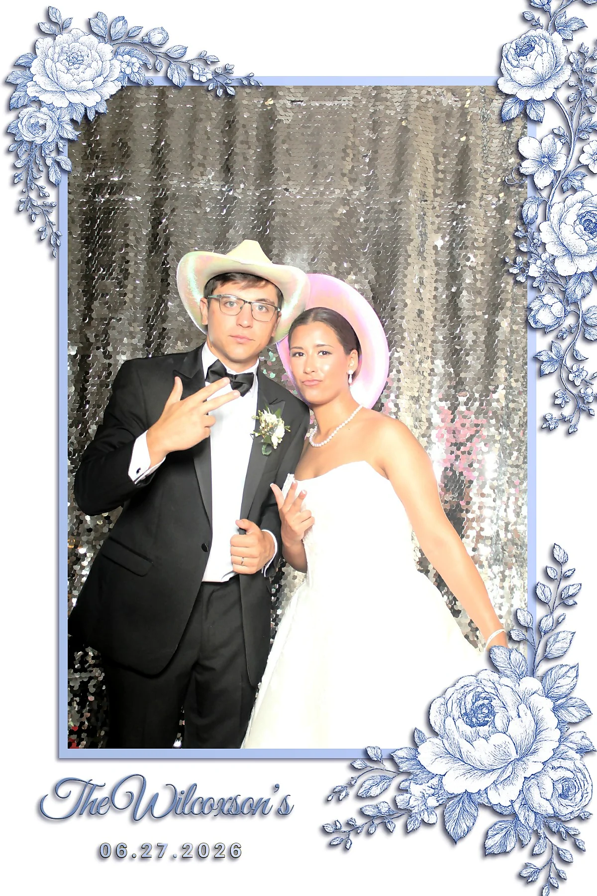 Custom wedding photo booth print for The Wilcoxson's dated 06.27.2026, designed with blue and white porcelain floral corners on a white mat and a script surname.